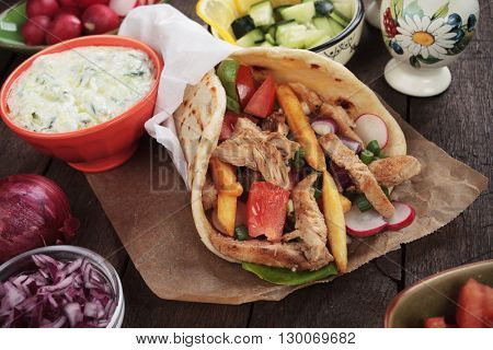 Doner kebab, turkish pita bread sandwich wit meat slices and vegetables