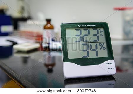 Digital hygro thermometer on table in laboratory