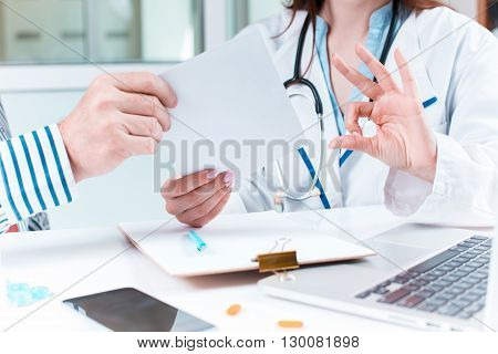 The patient and his doctor in medical office. Healthcare concept