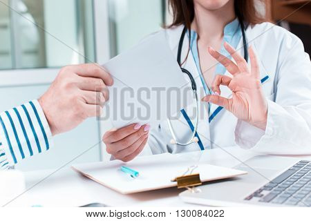 The patient and his doctor in medical office. Healthcare concept