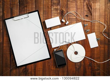 Blank stationery on vintage wooden background. Blank corporate identity template. Blank branding mock-up. Mockup for design presentations and portfolios. Top view.