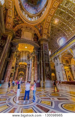 VATICAN, ITALY - JUNE 13, 2015: Side hall view of Saint Peter Basilica at Vaticano, indoors view of spectacular place.