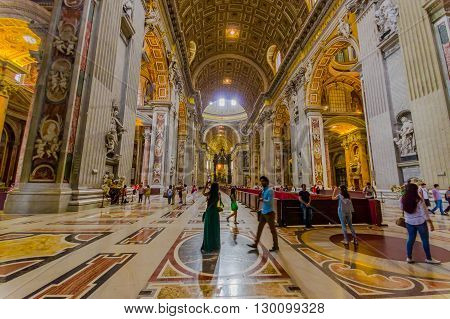 VATICAN, ITALY - JUNE 13, 2015: Main hall entrance and view of Saint Peter Basilica at Vaticano, gold covered, spectacular place.