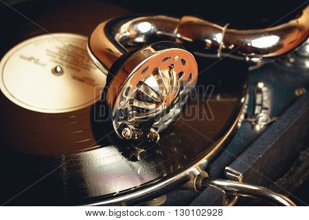 Old record player gramophone needle on record closeup. vintage toning
