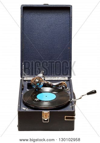 Gramophone with a vinyl record on wooden table. Isolated on white background
