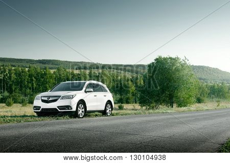 Saratov, Russia - August 11, 2015: Modern car Acura MDX standing on road at sunset