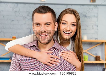 Beautiful Smiling Woman Huging Her Handsome Husband