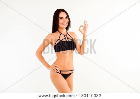 Young Healthy Woman In Black Lingerie Gesturing 