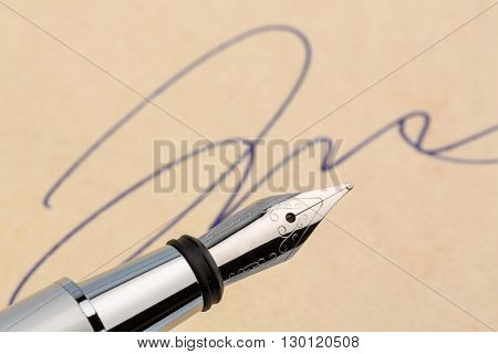 signature and a fountain pen