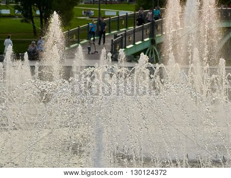 part of fountain and space with people on bridge in Tsaritsyno park. Moskow, Russia.