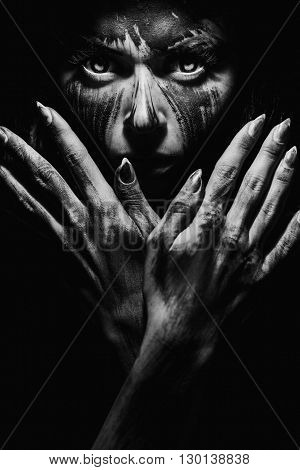 Scary portrait of the woman. Demon theme on Halloween. Black-and-white Version of the Image