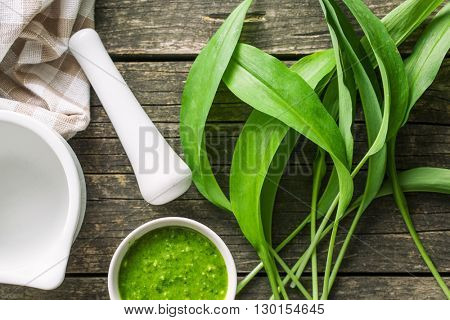 Fresh ramsons leaves. Wild garlic leaves and tasty pesto. Healthy vegetable.