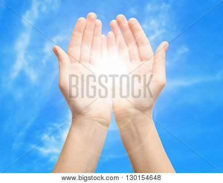 Female hands with sun