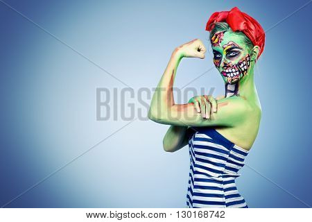 Glamorous zombie girl. Portrait of a pin-up zombie woman. Body-painting project. Halloween make-up.