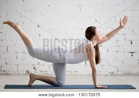 Portrait Of Beautiful Woman Doing Chakravakasana Pose
