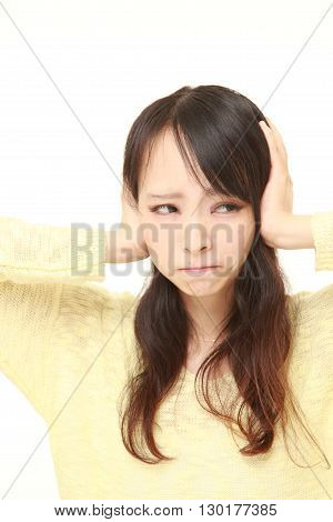 portrait of Young Japanese woman suffers from noise on white background