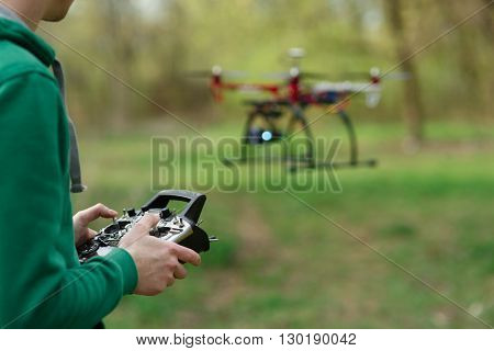 Man controling a drone.