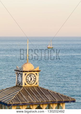 Old clock on a tower of Eastbourne's historical Victorian Pier