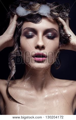 Beautiful girl with wat hairstyle and bright makeup. Beauty face.