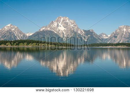 The Teton Range reflected in the Jackson Lake Grand Teton National Park