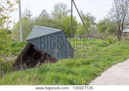 near the road toppled building a gazebo after storm