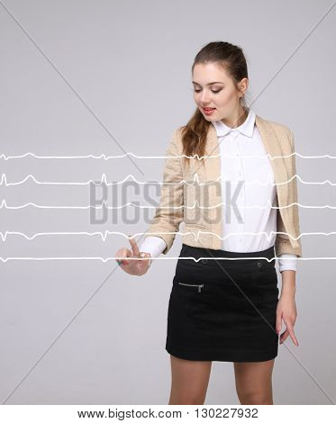 Doctor woman working with cardiogram lines