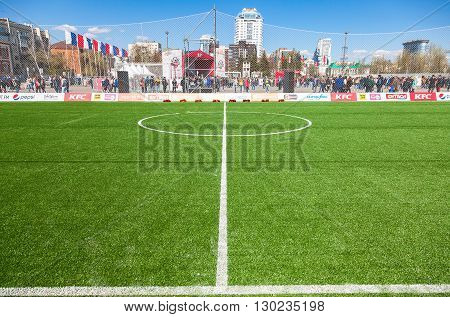 SAMARA RUSSIA - APRIL 24 2016: White lines marking on green grass on the soccer or football field. Open sport festival on the central square in Samara Russia