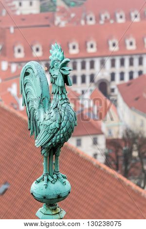 bronze weathercock at the roof of st vitus cathedral at prague castle czech republic