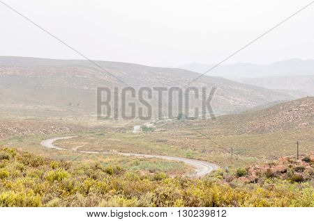 A wet Nuwekloofpas (new valley pass) descending into the Baviaanskloof (baboon valley) during a rain storm