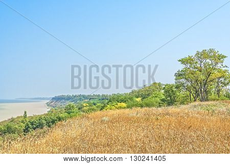 Picturesque steep bank of the gulf on a sunny summer day