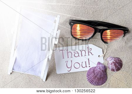 Sunny Summer Label With English Text Thank You. Flat Lay View. Summer Decoration With Deck Chair, Seashells And Sunglasses. Greeting Crad With Sand Background