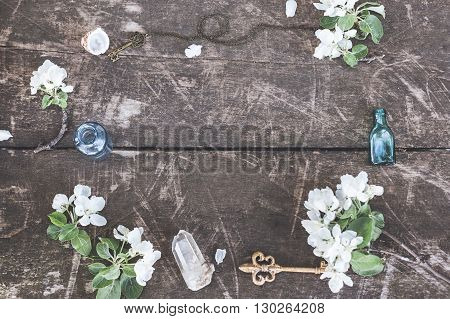 Stylish branding mockup with flowers, jars and crystalls to display your artworks. Cute vintage mock up on wooden background.