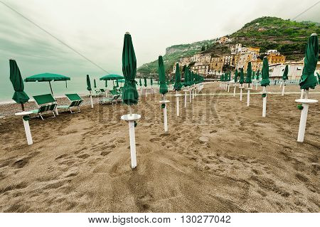 Beach Umbrellas on the Background of the Italian City of Minori