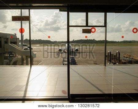 BATAM INDONESIA - DECEMBER 13, 2014: Planes parked at Hang Nadim International Airport in Batam Indonesia.
