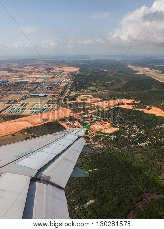 BATAM INDONESIA - DECEMBER 13 2014: View of the land of Batam Island as seen from airplane window.