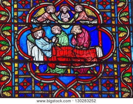 PARIS, FRANCE - MAY 31, 2015 King Death Bed Angels Medieval Stories Stained Glass Notre Dame Cathedral Paris France. Notre Dame was built between 1163 and 1250AD.