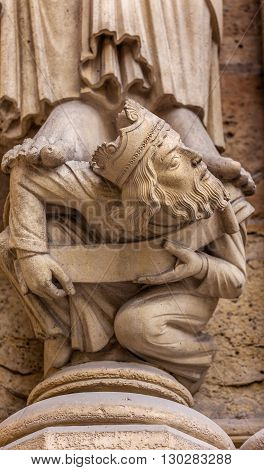 Headless King Facade Notre Dame Cathedral Paris France. Notre Dame was built between 1163 and 1250 AD.