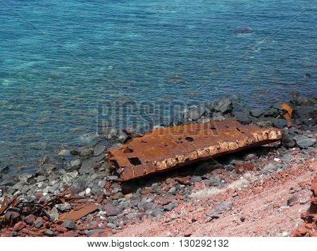 Rusted ship wrack abandoned at the coast