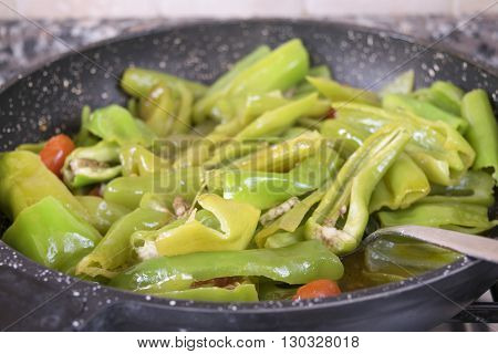 fried friarelli in pan a traditional kind of hot peppers
