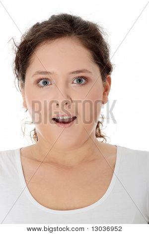 Amazed corpulent woman isolated on white background