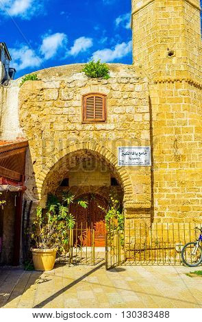 TEL AVIV ISRAEL - FEBRUARY 25 2016: The arched entrance leads to the Mahmoudiya Mosque on February 25 in Tel Aviv.