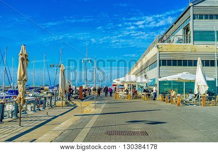 TEL AVIV ISRAEL - FEBBRUARY 25 2016: The old Jaffa port is the best place to eat in local cafe and enjoy the yachts on February 25 in Tel Aviv.