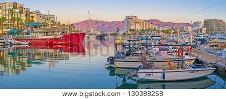 EILAT ISRAEL - FEBRUARY 23 2016: The sea trips and fishing are the most popular attractions in resort so there are always many yachts in Lagoona on February 23 in Eilat.