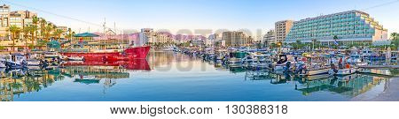 EILAT ISRAEL - FEBRUARY 23 2016: The panorama of the evening marina the yachts are reflected in clear surface of water on February 23 in Eilat.