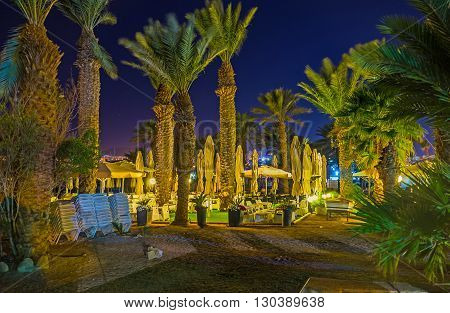 The beach restaurant hidden among the palms in beautiful garden Eilat Israel.