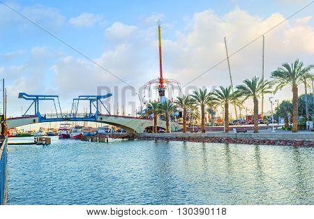 EILAT ISRAEL - FEBRUARY 23 2016: The modern promenade leads to the drawbridge and central amusement park on February 23 in Eilat.