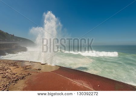 Strong Waves Crashing into Sao Conrado beach promenade in Rio de Janeiro, Brazil