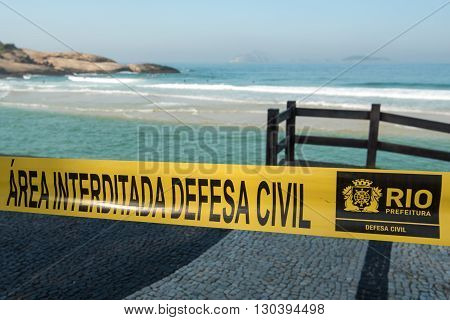 RIO DE JANEIRO, BRAZIL - MAY 7, 2016: Arpoador beach is fenced with tape by Civil Defense because of the waves of a strong undertow.