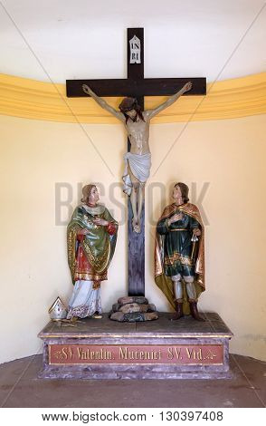 STITAR, CROATIA - AUGUST 27: St Valentine martyr and St. Vitus martyr under the crucifix in the chapel in the village Stitar, Croatia on August 27, 2015