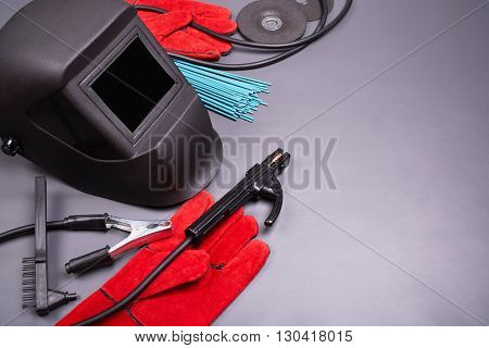 Welding equipment, welding mask, protective leather gloves, welding electrodes, high-voltage wires with clamps, cutting disc for grinder, set of accessories for arc welding.